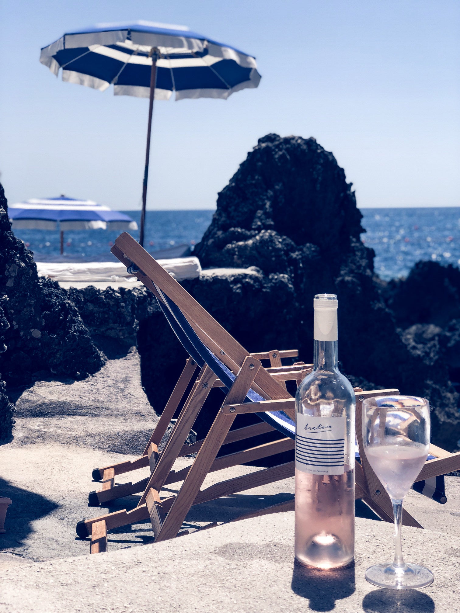 Man with hat drinking rose from cotes de provence 